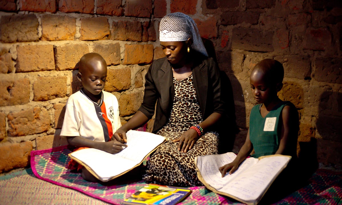 African woman educating kids